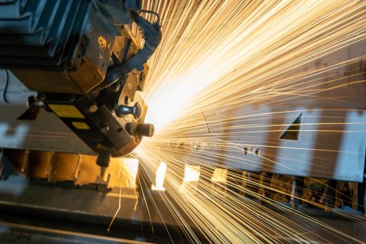 Manufacturing with cutter and sparks flying