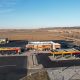Aerial view shows expanded truck‑parking capacity at a modern Love’s travel center.