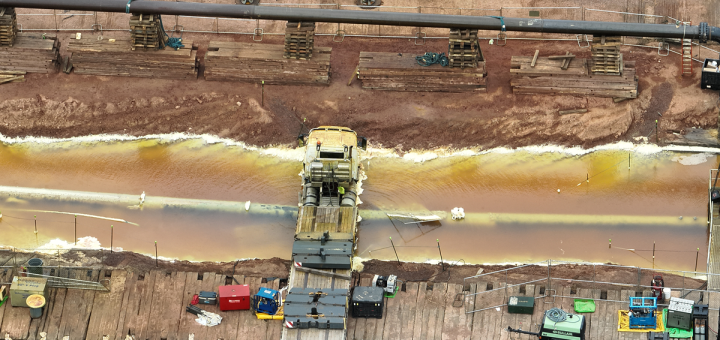 Aerial view of a flatbed truck in the excavated Enbridge Line 5 valve site in Iron County, Wisconsin, on Aug. 29, 2026.
