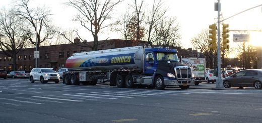 Aerial view of a white Sunoco storage tank and connecting pipelines near Detroit
