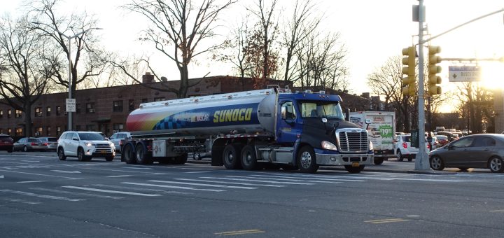 Aerial view of a white Sunoco storage tank and connecting pipelines near Detroit