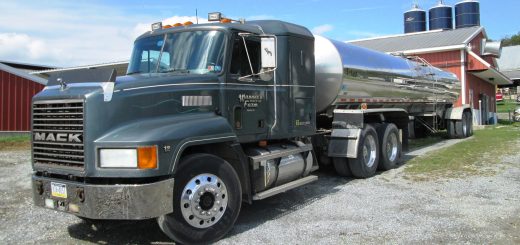 Stainless-steel milk tanker parked at a dairy farm in Pennsylvania