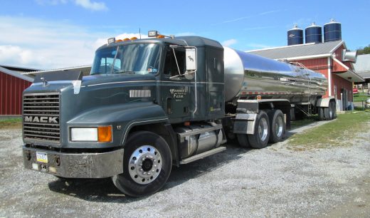 Stainless-steel milk tanker parked at a dairy farm in Pennsylvania