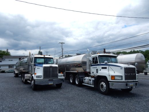 Milk-hauling trucks parked at the Centerport Milk Hauling Cooperative in Pennsylvania.