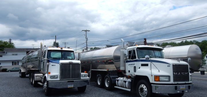 Milk-hauling trucks parked at the Centerport Milk Hauling Cooperative in Pennsylvania.