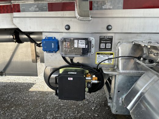 Tremcar trailer equipment panel with an RVS module, TireView LIVE enclosure and Air-Weigh iWeigh identification label.