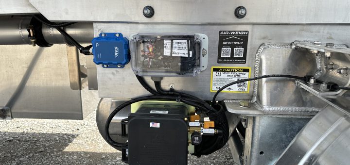 Tremcar trailer equipment panel with an RVS module, TireView LIVE enclosure and Air-Weigh iWeigh identification label.