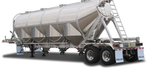 Silver Polar 1660 four-hopper dry-bulk trailer with a rear access ladder and tandem axles.