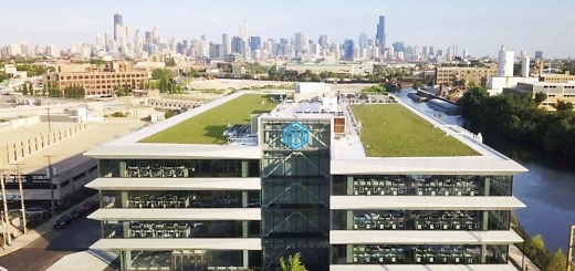 C.H. Robinson’s Chicago Central office beside the river with the Chicago skyline behind it